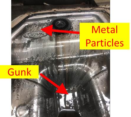 Transmission Pan showing metal fragments and gunk